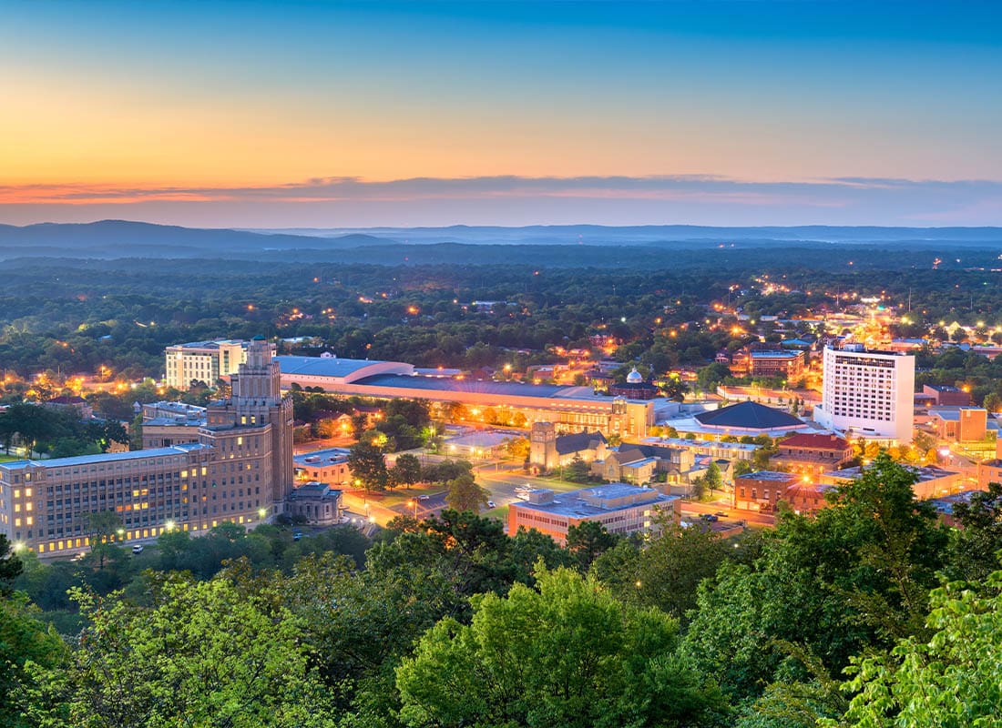 Hot Springs, AR - Hot Springs, Arkansas Skyline With Bright Night Lights During the Evening